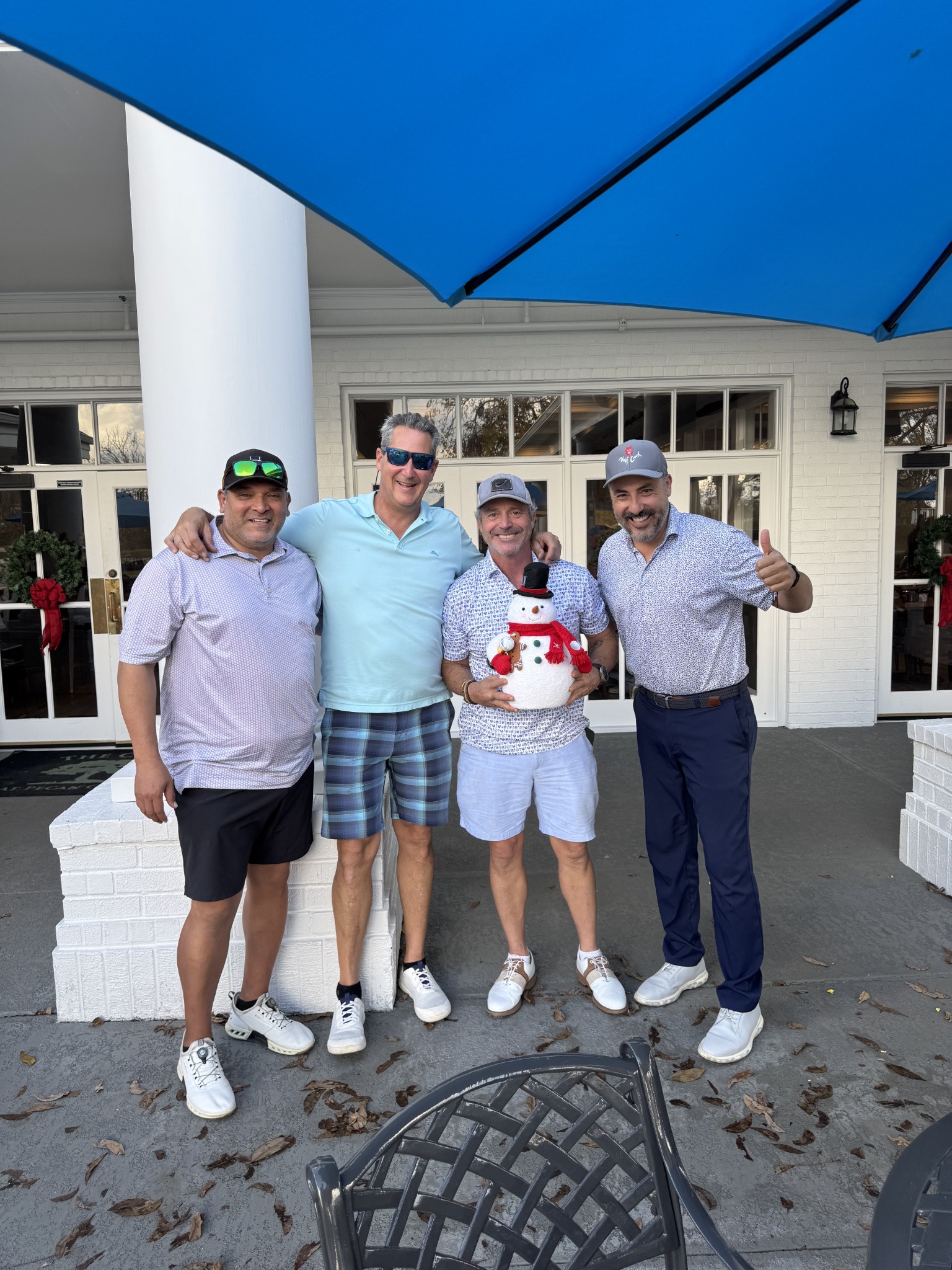 The 2025 winning team gathered together after the scramble.